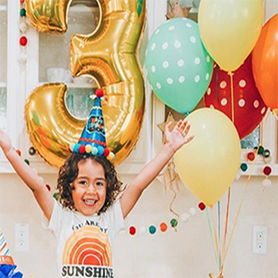 Birthday balloons with gold number balloon and colorful latex balloons